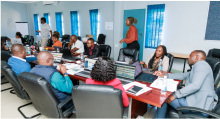 Photo of people attending a meeting.